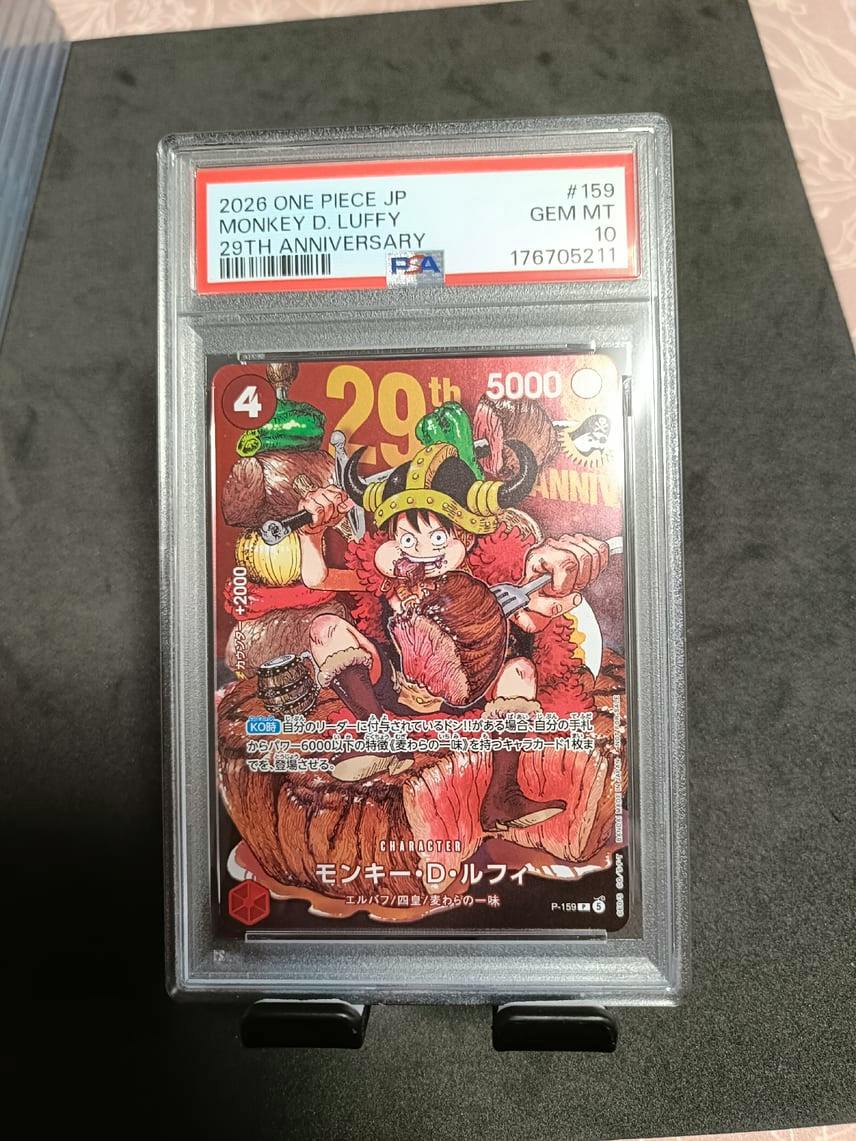 Front of a PSA-graded Monkey D. Luffy trading card (P-159, 29th anniversary) shown in a plastic grading slab with visible label and card artwork.