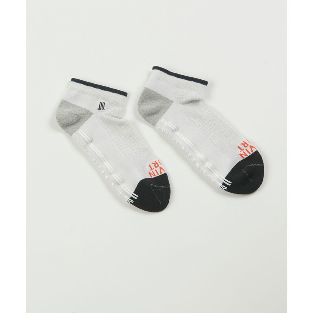 A pair of men's ankle-length cotton socks in white with gray heels and black toes laid flat on a white background.