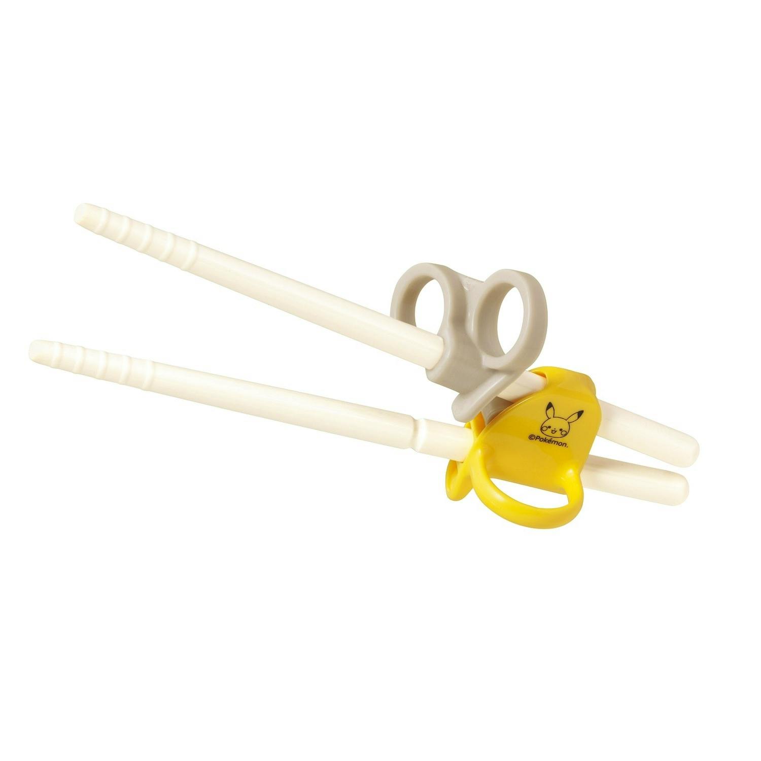 Right-handed baby training plastic chopsticks with a yellow Pikachu connector and grey finger rings on a white background.