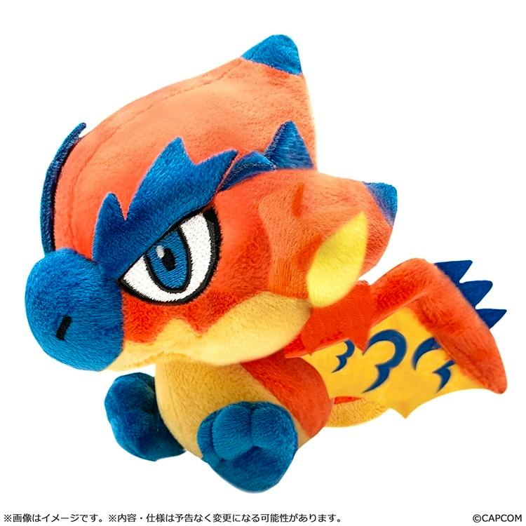 Front three-quarter view of the Monster Hunter モンでふぉ リオレウス plush toy with an orange body, blue snout and feet, and yellow wing details.
