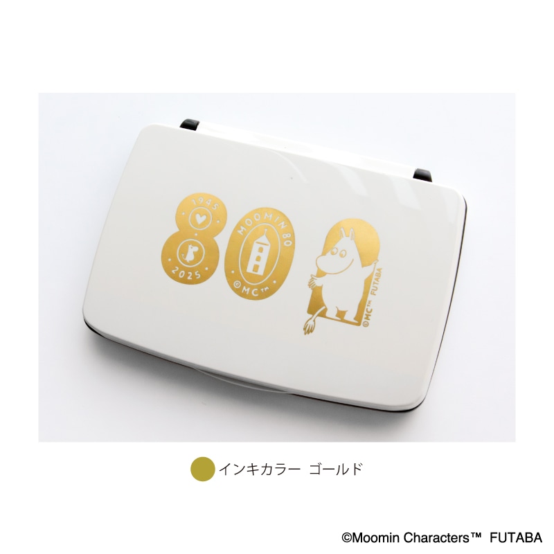 Closed white stamp pad case featuring a gold Moomin 80th anniversary design on the lid.