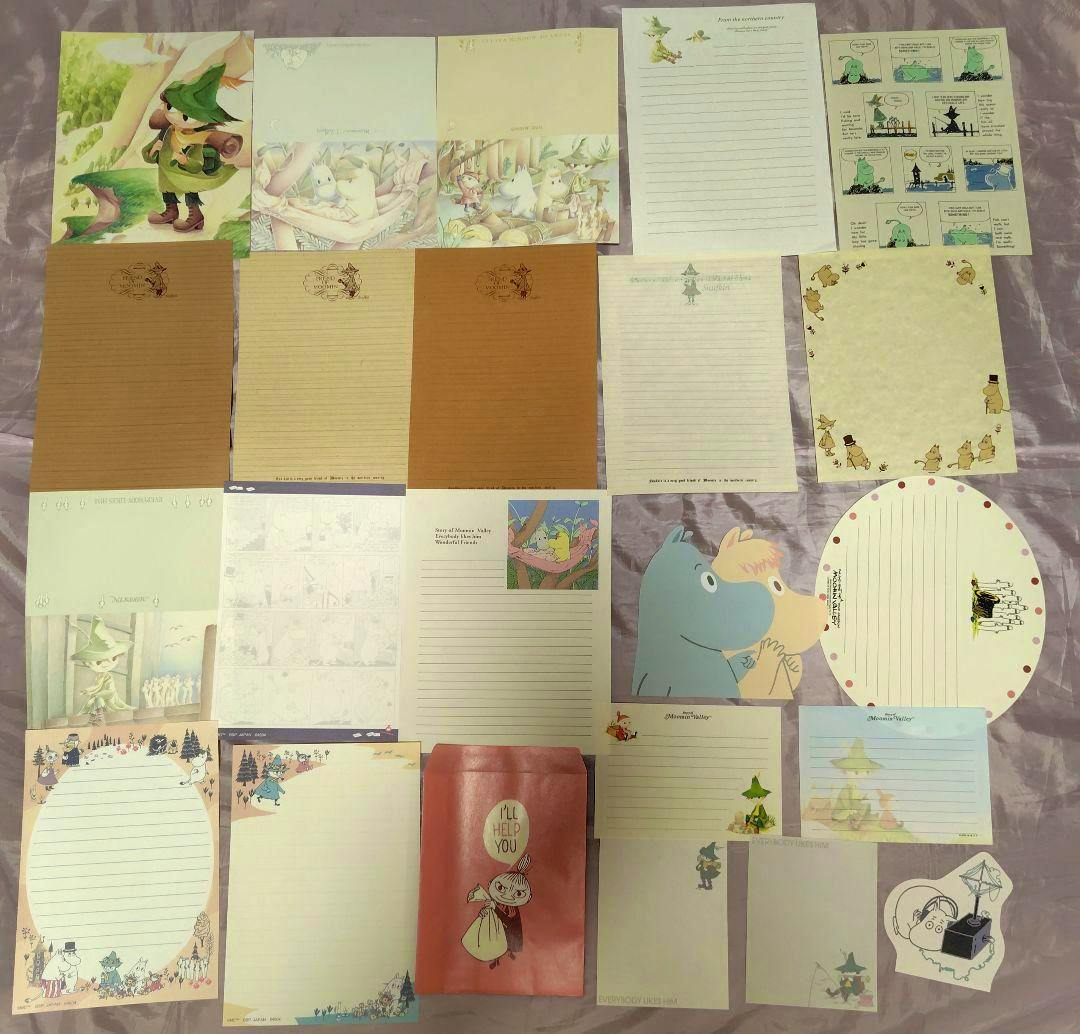 A spread of Moomin-themed memo and letter papers laid flat showing multiple illustrated designs including Snufkin and Little My.
