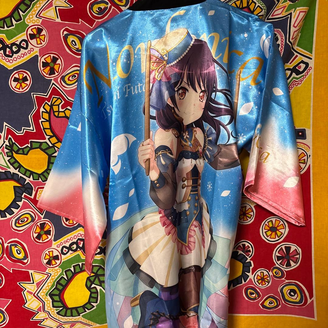 Back view of the Morfonica 二葉つくし happi coat showing a large printed anime character on blue-to-pink polyester fabric.