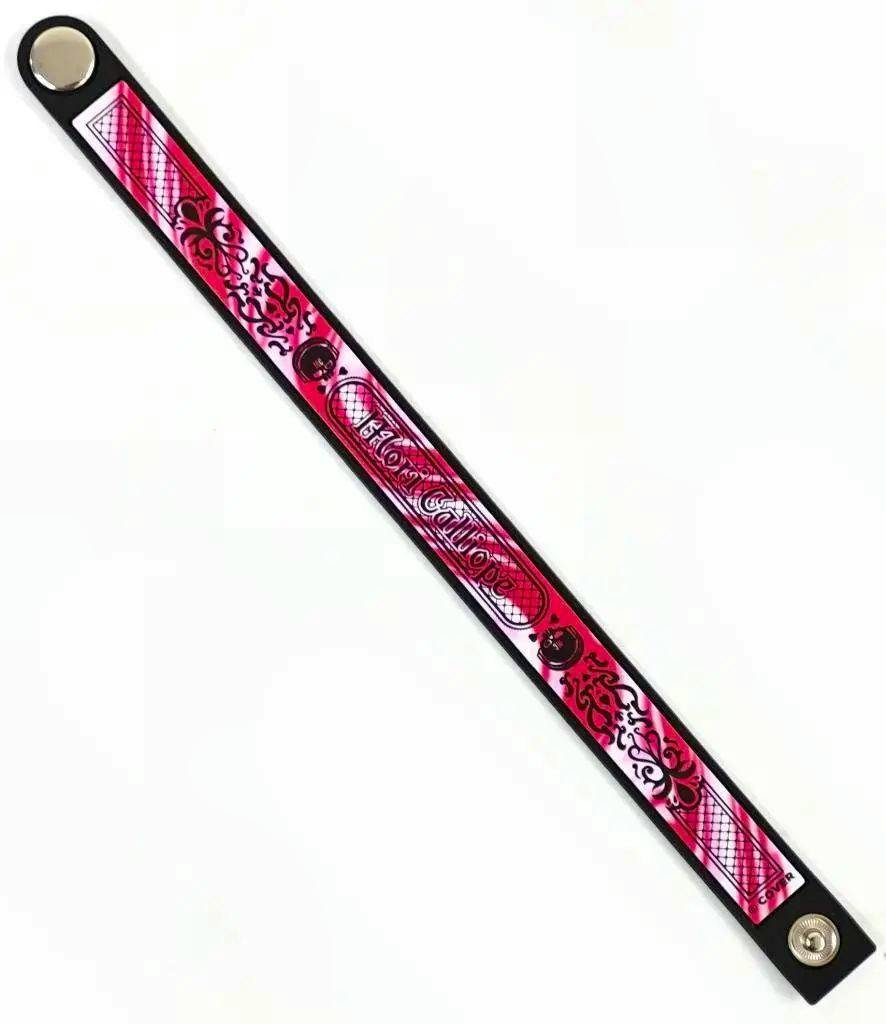 Pink Mori Calliope Underworld Concert rubber snap bracelet laid flat on a white background.