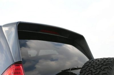 Motrage Prado 120 roof spoiler installed above a vehicle's rear window and center brake light.