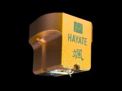 Close-up photo of the MUTECH RM-HAYATE MC record player cartridge showing its gold-colored body with 'HAYATE' text.
