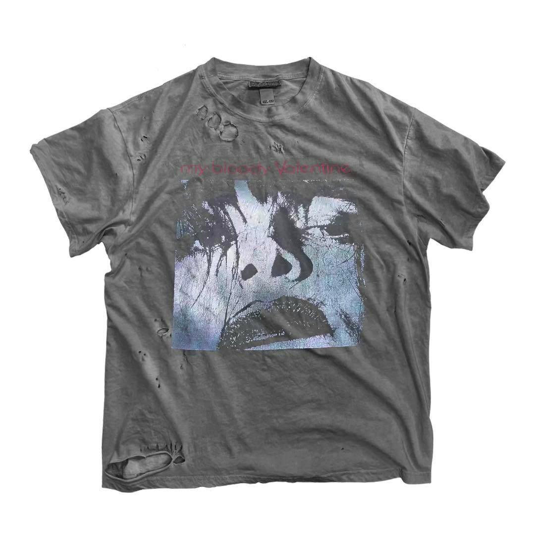 Gray men's My Bloody Valentine vintage-style cotton T-shirt laid flat showing a large face graphic and intentional distressed holes.