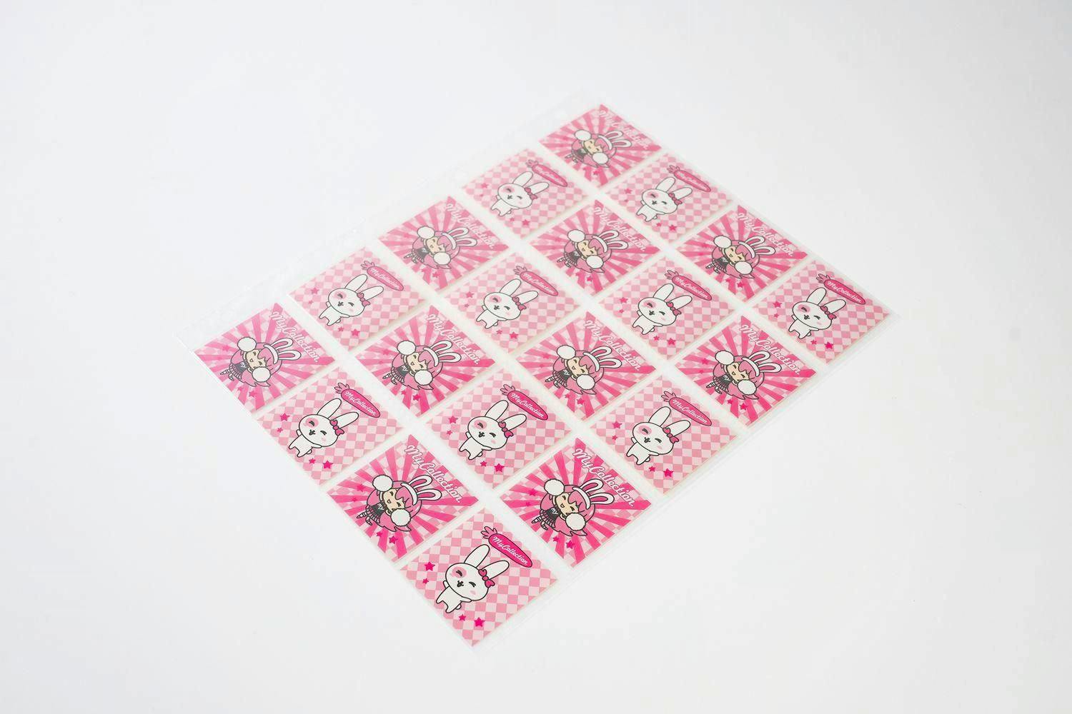 A clear plastic sticker storage refill sheet filled with pink rabbit-themed stickers on a white background.