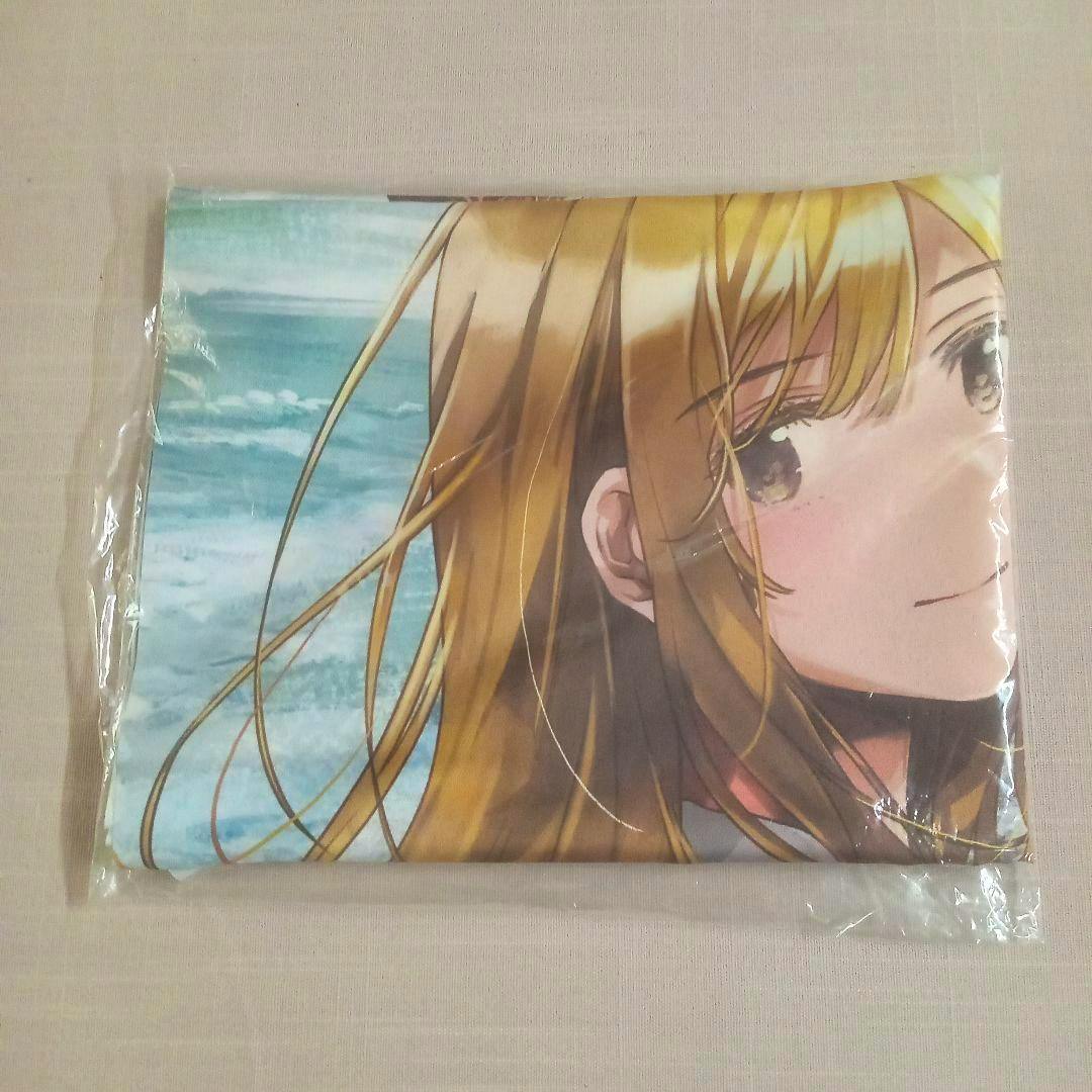 Folded B2 tapestry showing a close-up of a blonde anime girl's face with an ocean background, packaged in plastic.