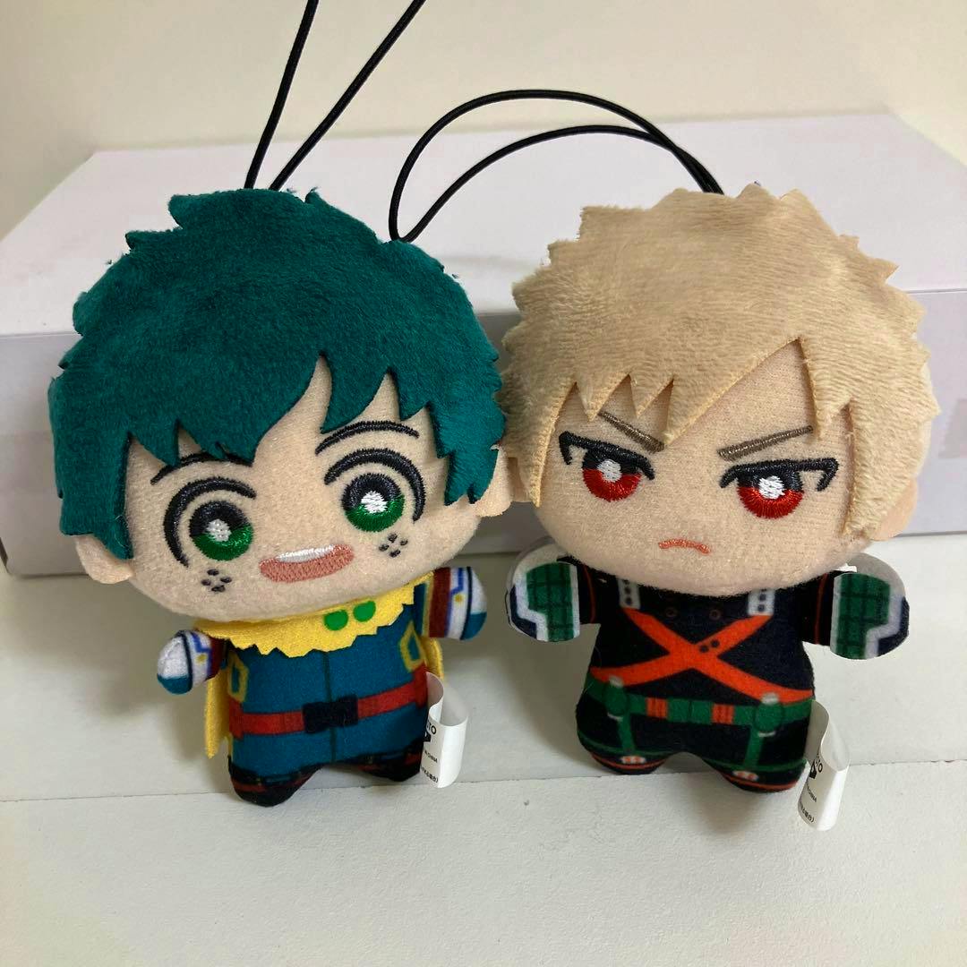 Two toy plush dolls (My Hero Academia) of Midoriya Izuku (green hair) and Bakugo Katsuki (blond hair) standing side by side.