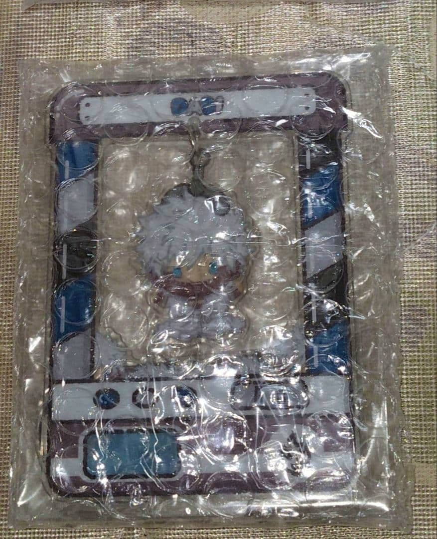 A Dabi acrylic decorative stand (My Hero Academia) shown packaged in clear bubble-sealed plastic with its illustrated backing card.