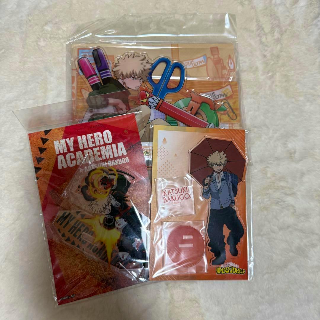 Packaged acrylic stands of Katsuki Bakugo from My Hero Academia shown as a three-piece set in their plastic sleeves.