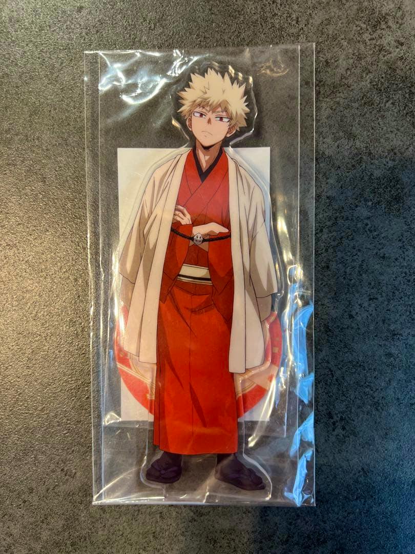 An unopened acrylic decorative stand of Bakugo Katsuki from My Hero Academia in red kimono, sealed in plastic packaging.