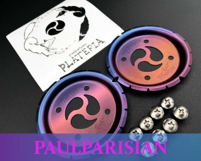 Two neon purple circular flex-booster caps and six screws arranged on a black background.
