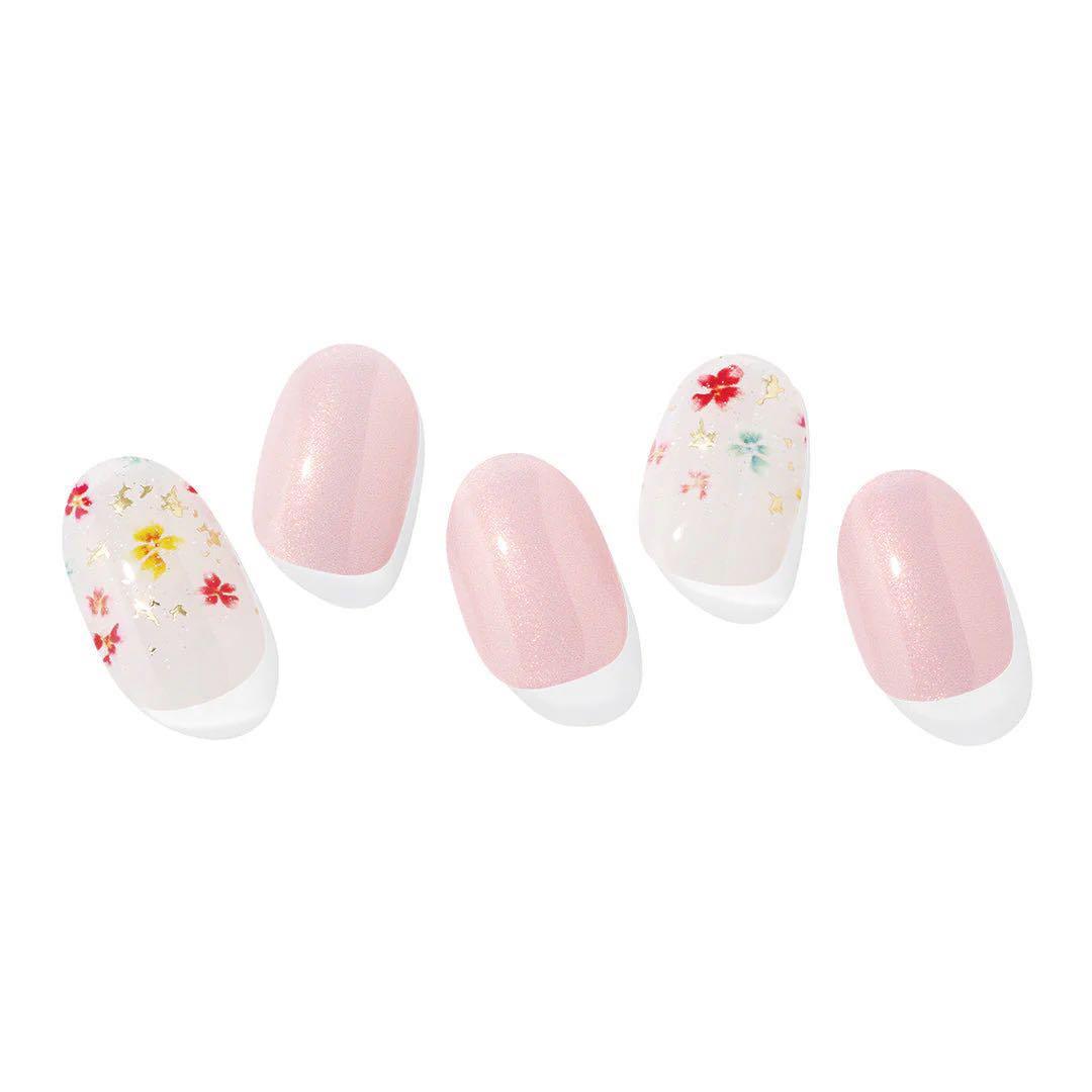 Five nail tips showing pink and white floral nail sticker designs for a nail sticker product.