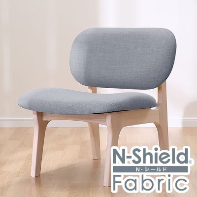 Gray fabric single wooden chair with rounded backrest and light wood frame.
