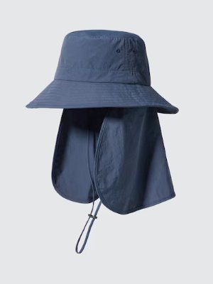 Blue nylon sun hat with a wide brim, attached neck flap, and chin cord on a light gray background.