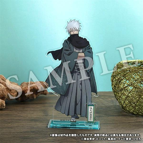 An acrylic stand of Hatake Kakashi on a clear base displayed against a teal background with a SAMPLE watermark.