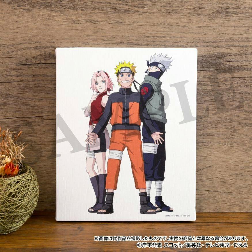 Canvas board featuring Naruto, Sakura, and Kakashi standing together printed on a white background, propped against a wooden surface.