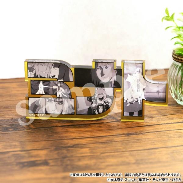A Naruto-themed acrylic name block for Minato displayed on a wooden surface, showing grayscale panels of characters from the series.