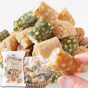Close-up of assorted individually wrapped Japanese biscuits (kinako, matcha, almond) with a retail bag visible in the background.