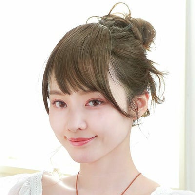 Close-up of a model wearing the synthetic side-bang wig with soft, hand-planted bangs.