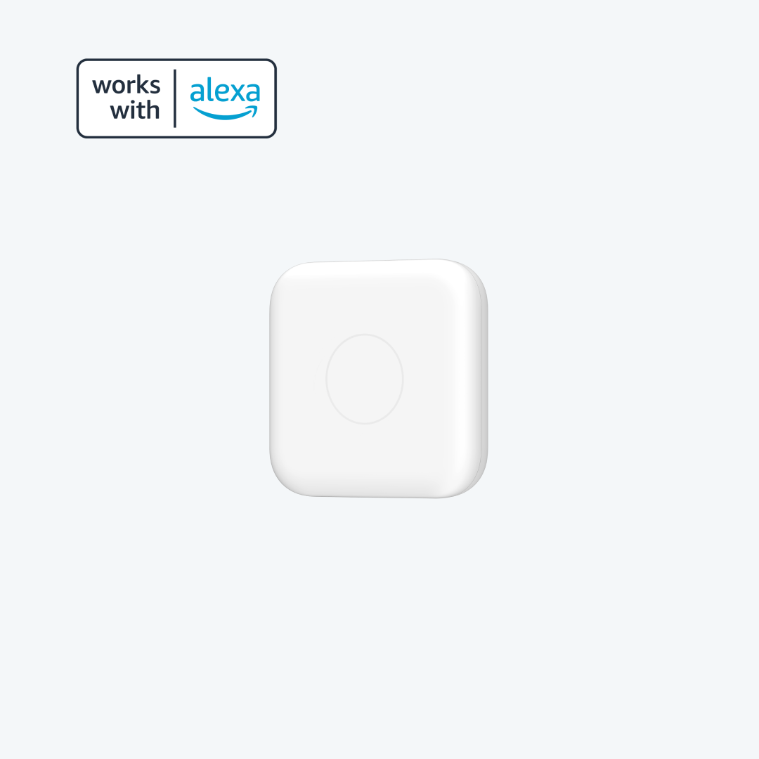 Front view of the white Nature Remo nano remote control with rounded corners, a central circular button, and a "works with Alexa" badge.
