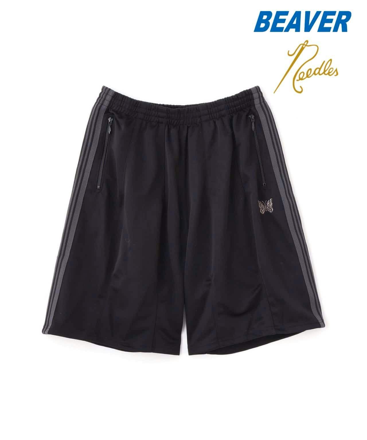 Black Needles H.D. track shorts with elastic waistband, zippered side pockets, grey side stripes, and butterfly logo.