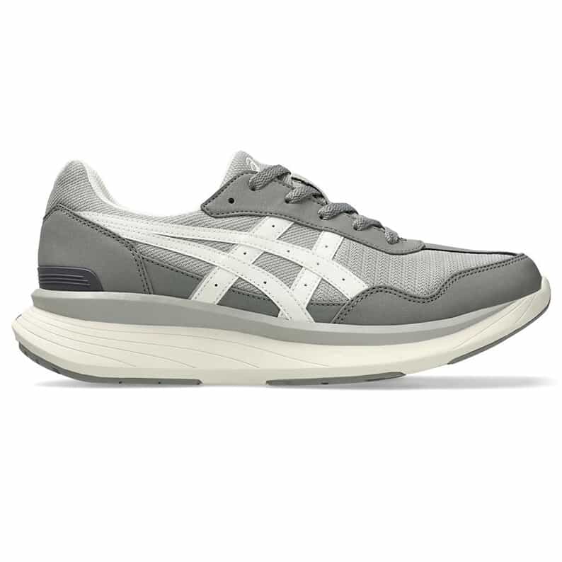 Side view of a gray and white men's sports shoe showing the upper, laces, and thick midsole.