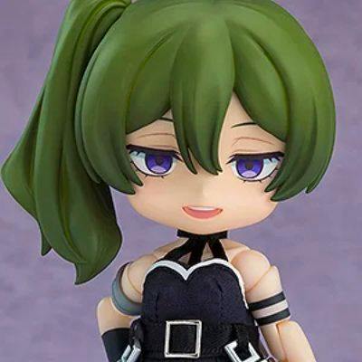 Close-up of the Nendoroid Doll "ユーベル" showing the figure's green ponytailed hair, purple eyes, and black outfit with belt.