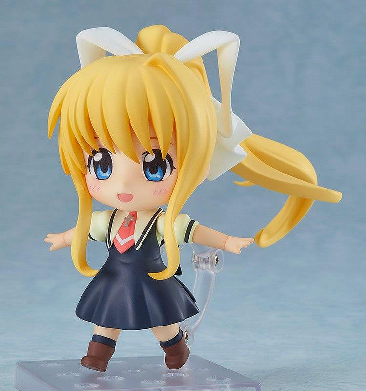 Nendoroid figure ねんどろいど 神尾観鈴 posed on a clear display stand against a light blue background.