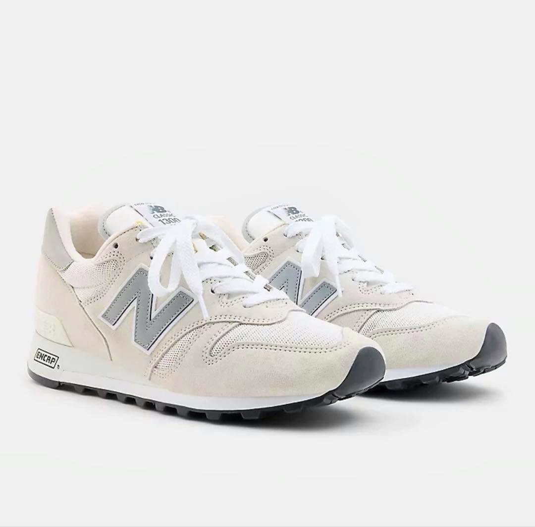 A pair of New Balance 1300 sneakers shown from a front three-quarter angle.