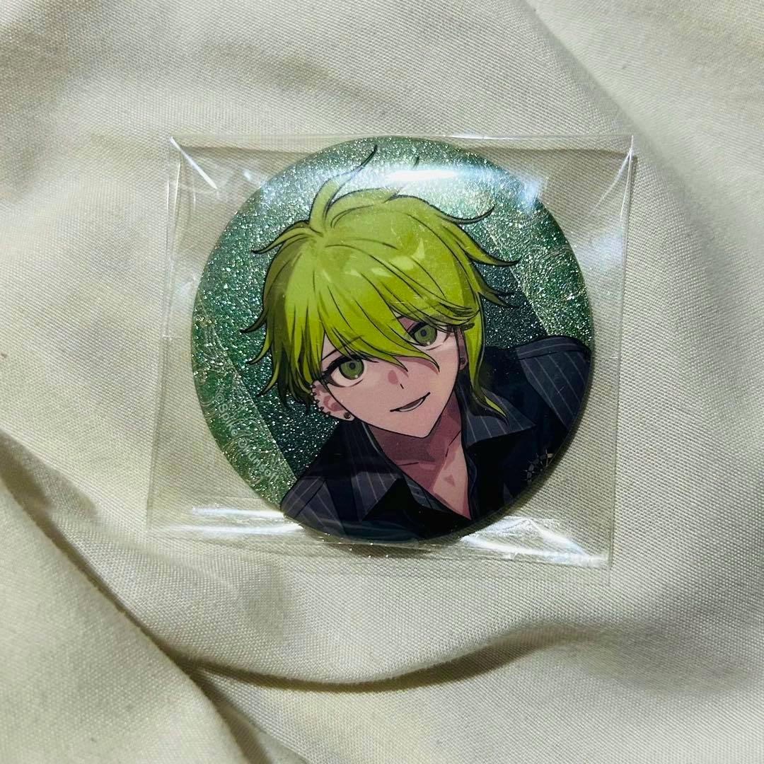 Round can badge featuring the illustrated character Rantaro Amami with green hair, shown in a clear plastic sleeve on light fabric.