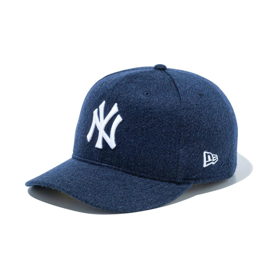 Navy 59FIFTY New York Yankees cashmere baseball cap with a white NY logo and a small New Era flag photographed on a white background.