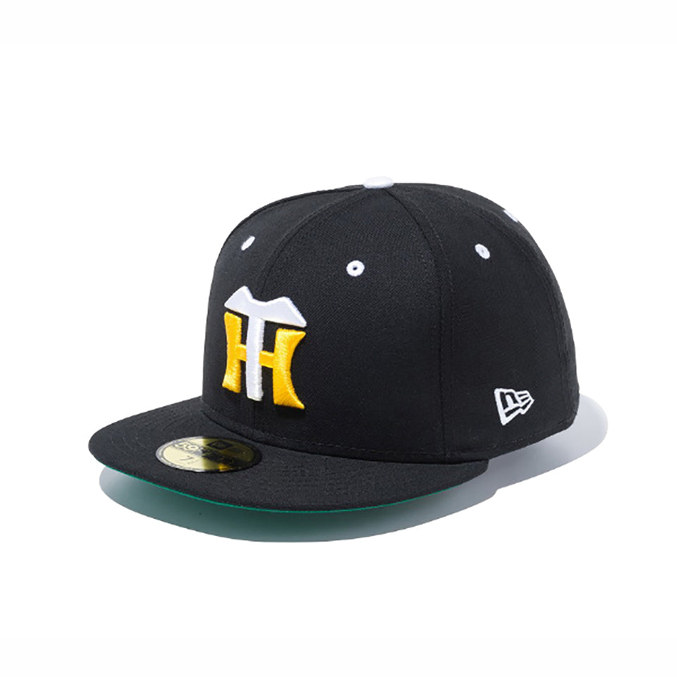 Black 59FIFTY baseball cap for the Hanshin Tigers with a yellow "H" logo and a green underbrim on a white background.