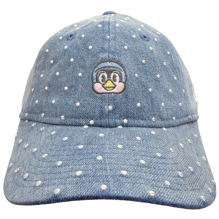 Front view of a kids' denim baseball cap with white polka-dot embroidery and a small embroidered Tsubakurō mascot face on the front.