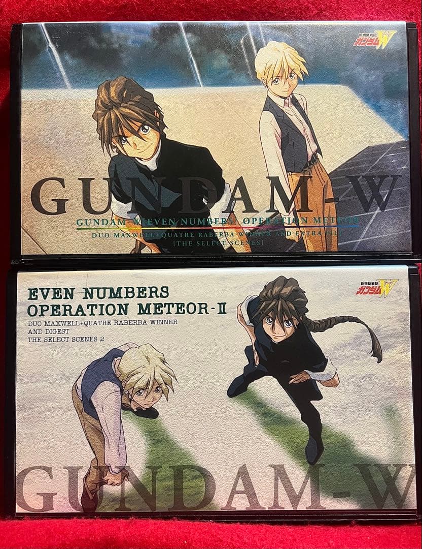 Front cover photo of a VHS tape for Mobile Suit Gundam W showing the characters Duo and Quatre on the artwork against a red background.