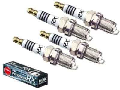Four NGK Premium RX spark plugs with an NGK product box visible.