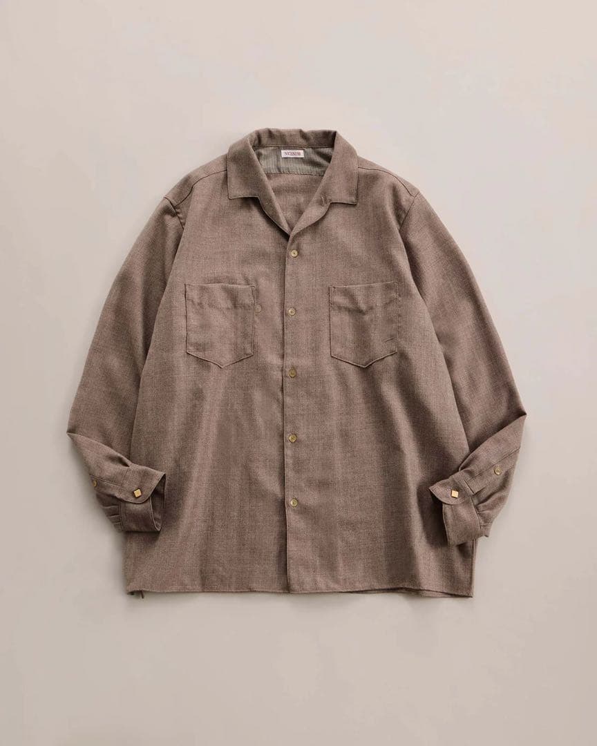 Taupe women's wool shirt with a collar and two chest pockets laid flat on a light background.