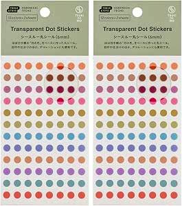 Two packs of see-through 6 mm round dot stickers in assorted colors on their backing cards and packaging.