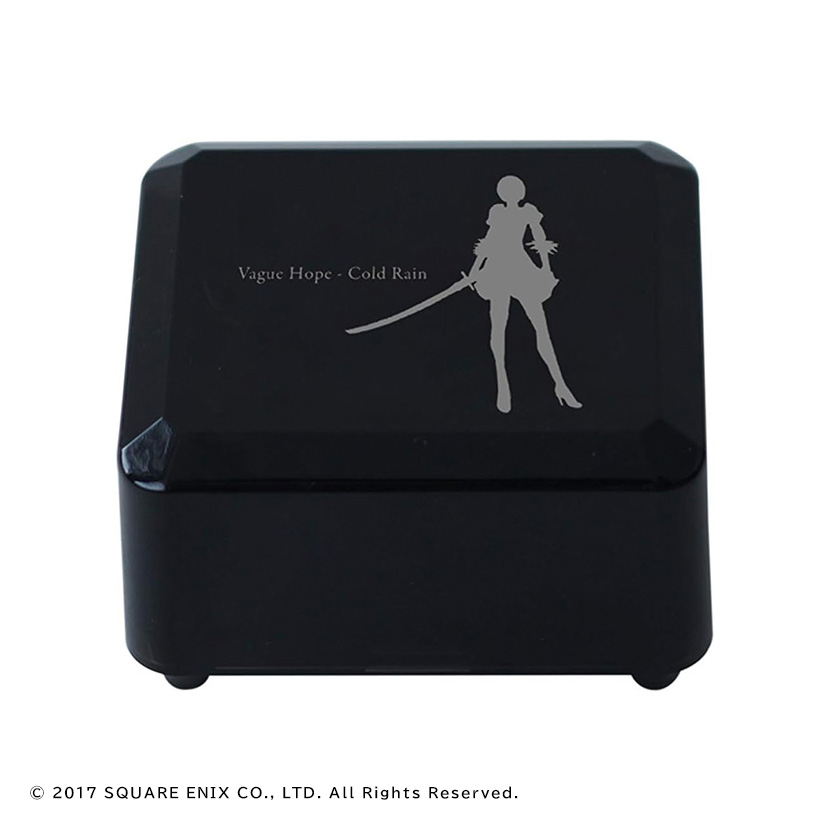 Black square music box with a silver silhouette of a NieR:Automata character and the text "Vague Hope - Cold Rain" on the lid.