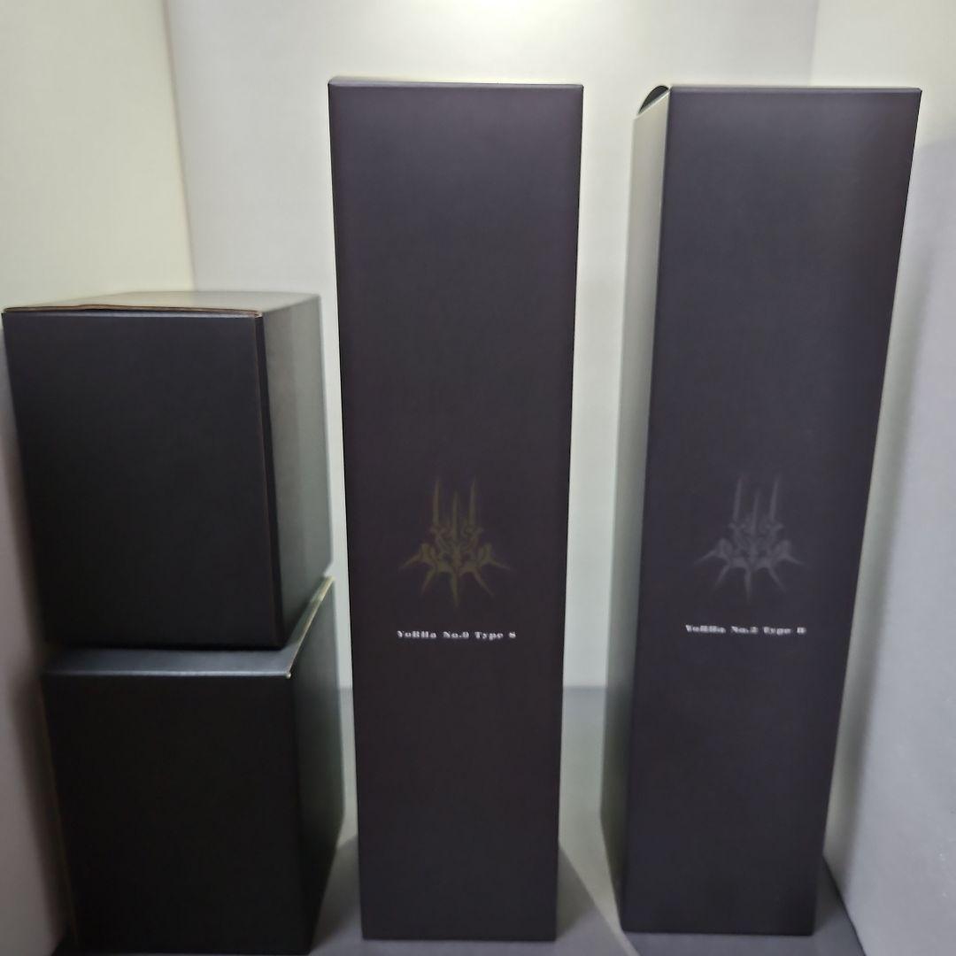 Two tall NieR:Automata-branded black boxes and two smaller black boxes arranged against a white background.