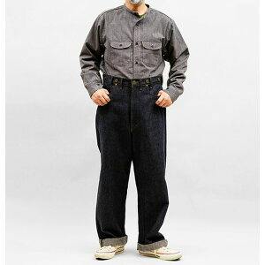 Male model shown full length wearing the dark Nigel Cabourn × Lee men's pants with hands near pockets.
