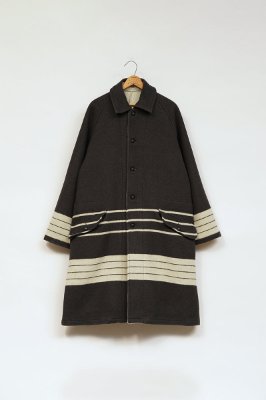 Front view of the men's Mountaineer Blanket Coat (wool) hanging on a hanger against a white background.