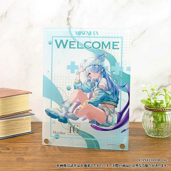 Acrylic display panel of Elira Pendora showing a seated character illustration with a 'WELCOME' header, standing on a wooden surface.