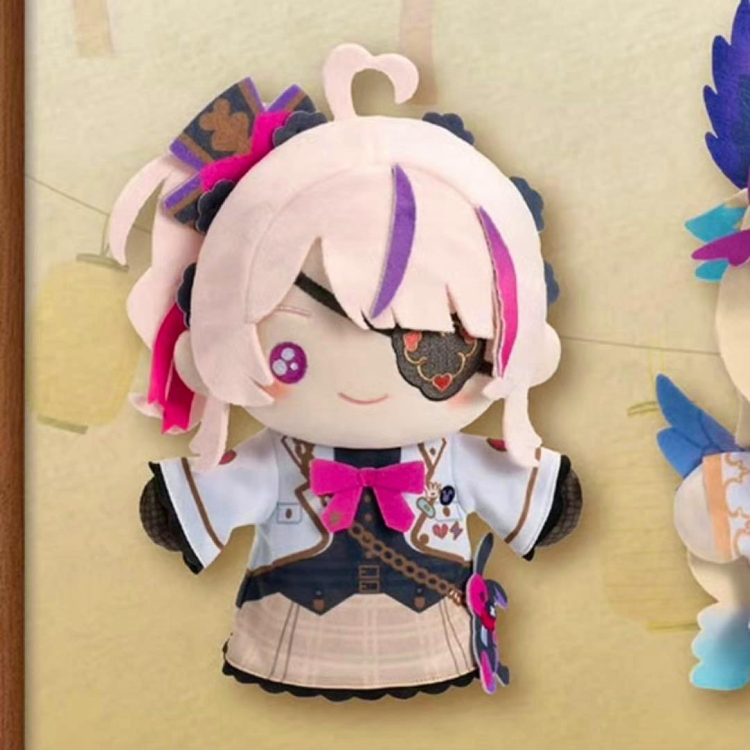 Front view of the NIJISANJI EN Maria Marionette plush showing pink hair, an eyepatch, and a detailed outfit with a pink bow.