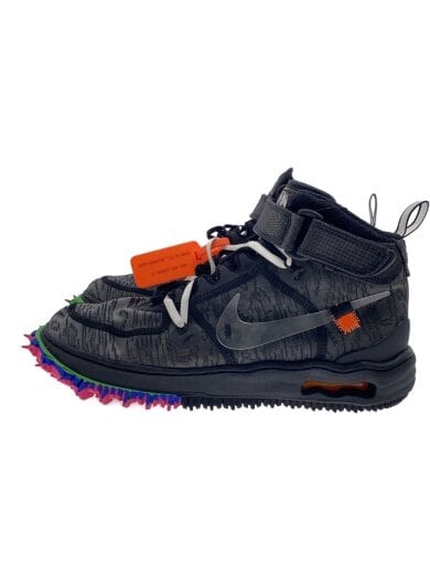 Side view of a black Air Force 1 Mid SP sneaker with a colorful spiked outsole and an orange tag.
