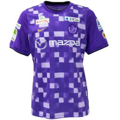 Front view of a purple Sanfrecce Hiroshima Dri-FIT prematch short-sleeve soccer training shirt with sponsor logos, club crest, and Nike Swoosh.