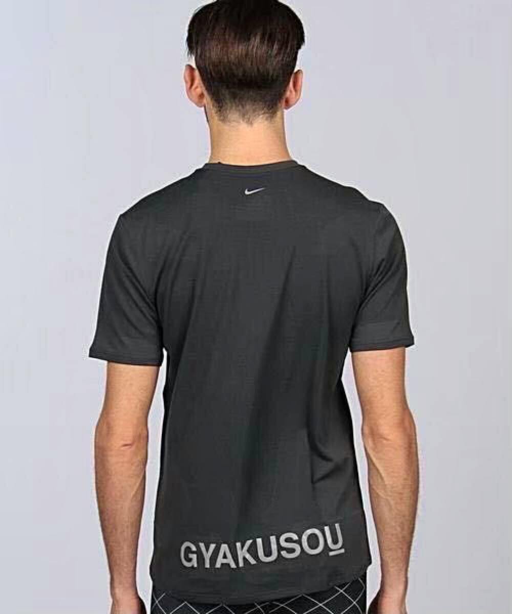 Back view of the men's GYAKUSOU Nike UnderCover short-sleeve DRI-FIT T-shirt on a model showing the GYAKUSOU lettering and small Nike logo.