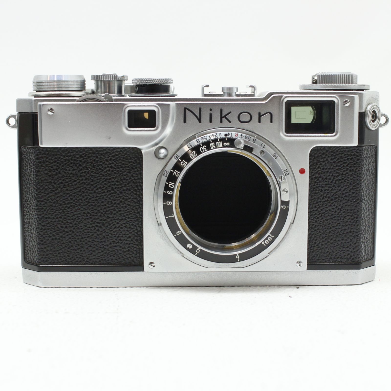 Front view of a Nikon S2 35mm film camera body showing the lens mount, viewfinders, and top controls.